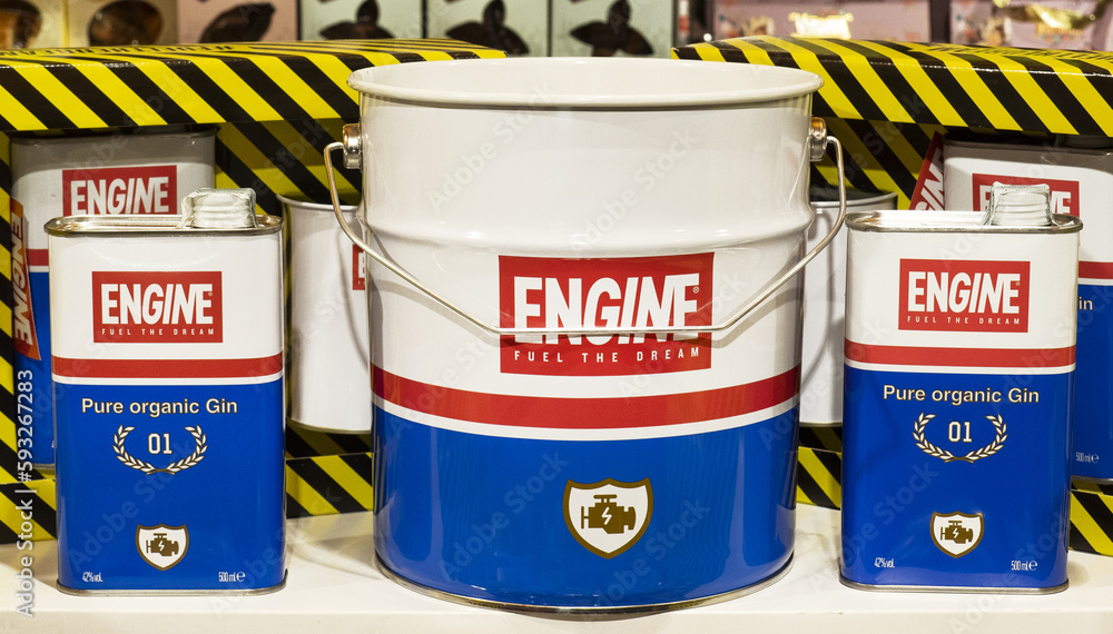 Ice bucket and vintage cans of engine oil containing pure organic