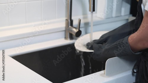 person washing dishes