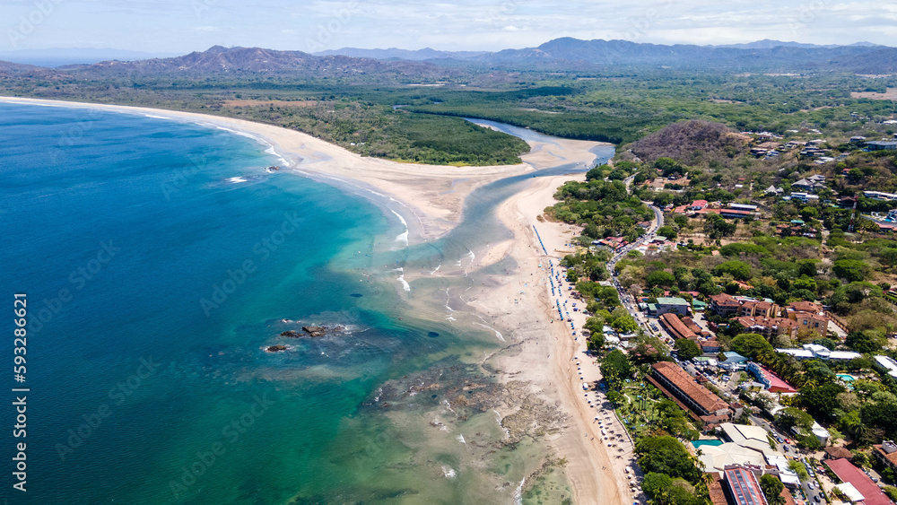 Aerial waves, Aerial Drone View of a tropical island with lush jungle in Costa Rica, Isla del Caño, Beautiful view of boats