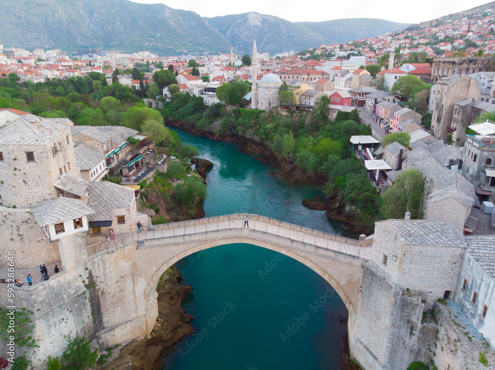erial Mostar Bridge and Koski Mehmed Pasha Mosque drone view of the historical city of Mostar, Ottoman architecture view of Bosnia is the most beautiful city in Europe