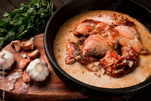 Shkmeruli, fried chicken, in milk-garlic sauce, Georgian cuisine, homemade, close-up, no people, photo