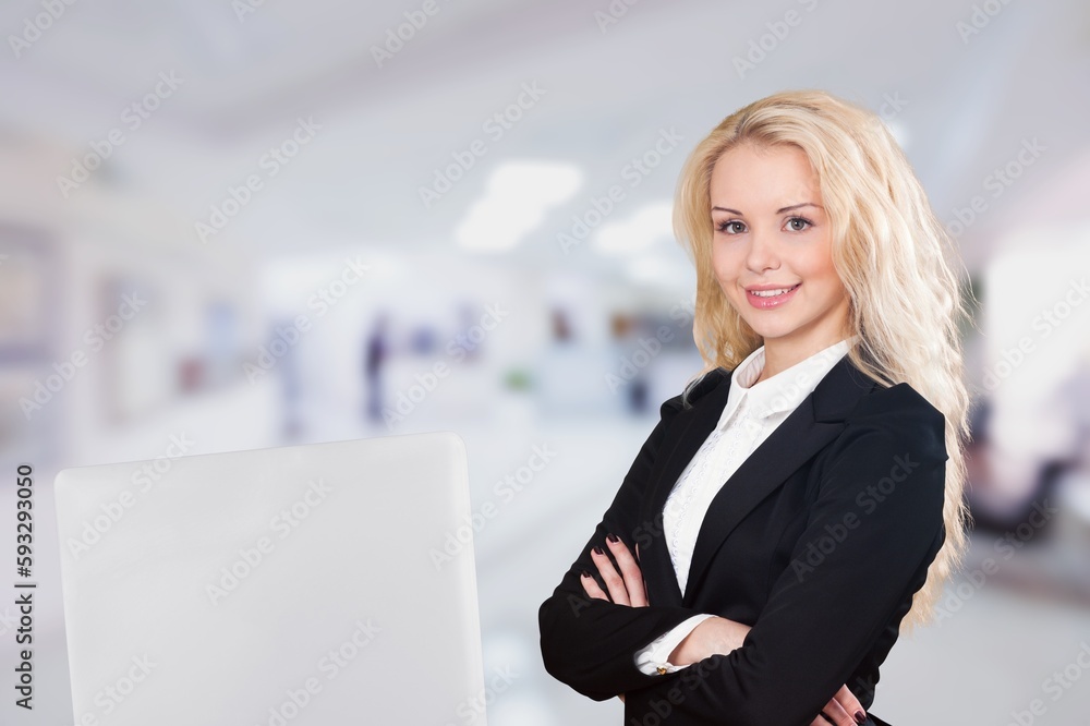 cheerful young businesswoman posing in office cheerful young businesswoman posing in office