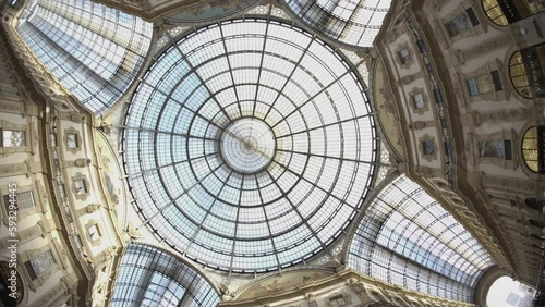Glass Dome in Vittorio Emanuele II Gallery. Spinning camera upward shot in Luxury shopping mall in Milano.