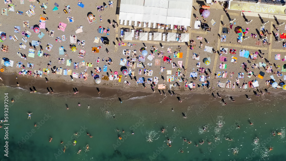 Sudak, Crimea - September 15, 2020: Embankment of Sudak. Black sea coast with beaches and people, Aerial View, HEAD OVER SHOT