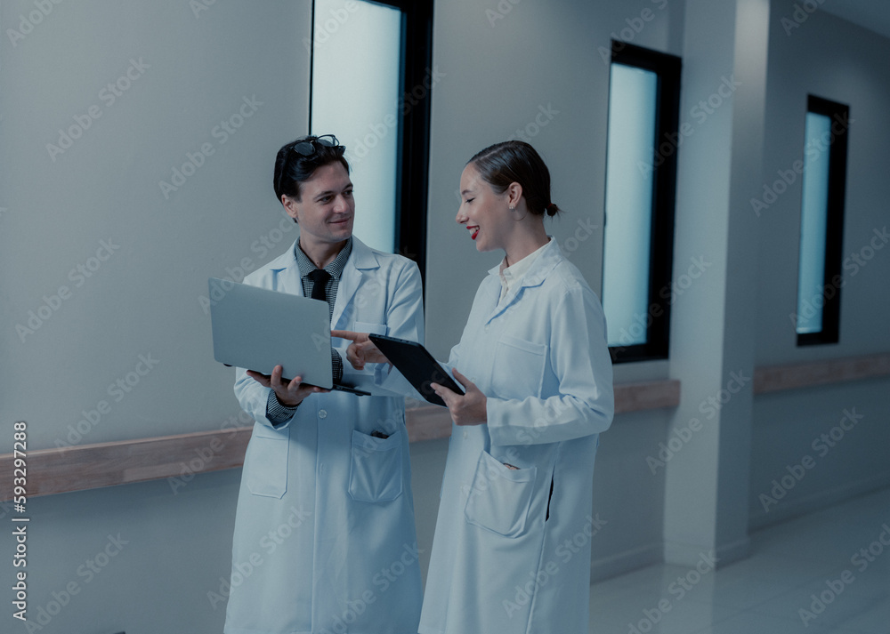 Doctor spend the break time to upgrade professional knowledge by reviewing medical publications, journals, and articles on digital devices, exchanging and discussing ideas with coworkers. Doctor spend the break time to upgrade professional knowledge by reviewing medical publications, journals, and articles on digital devices, exchanging and discussing ideas with coworkers.
