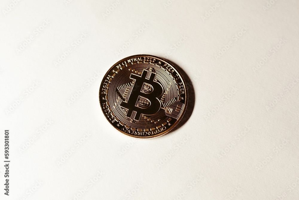 Closeup shot of a Bitcoin isolated on a white background Closeup shot of a Bitcoin isolated on a white background