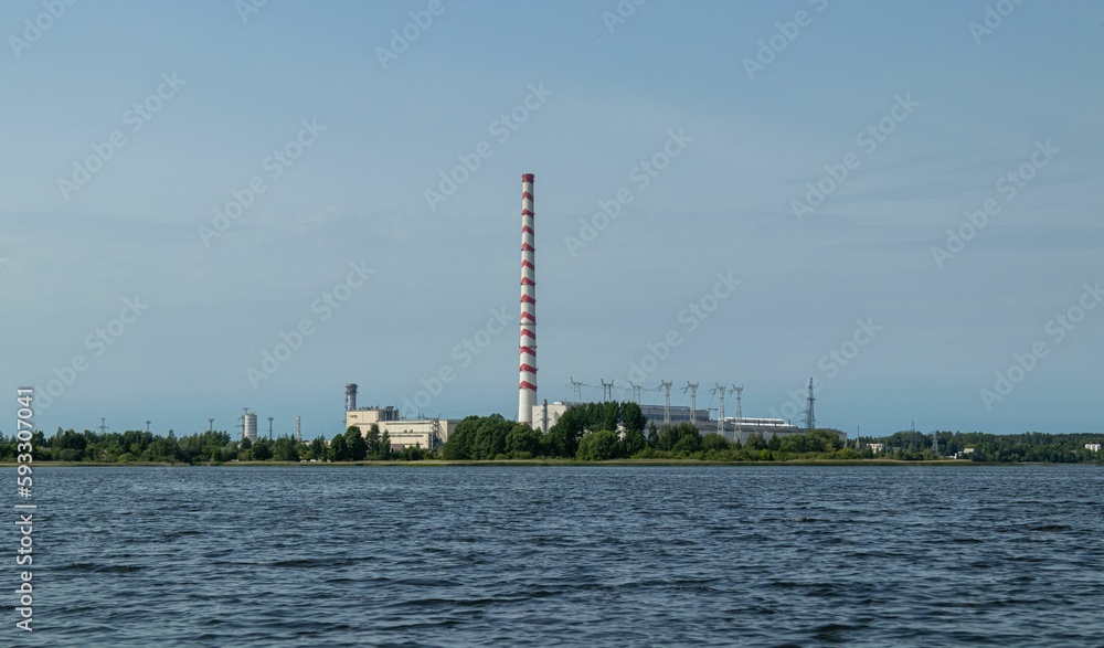 Power plant chimney in the middle of a lake