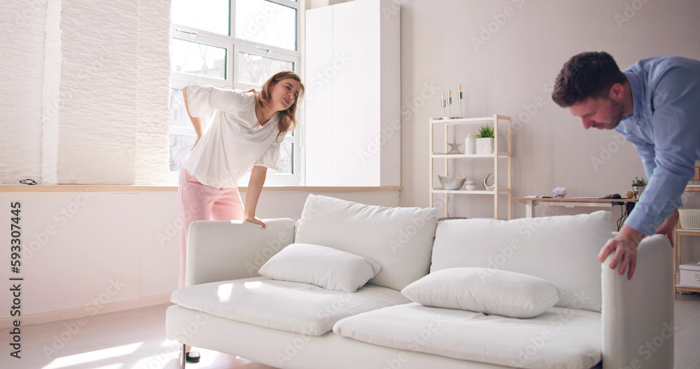 Person Lifting Heavy Furniture Couch Having Back Person Lifting Heavy Furniture Couch Having Back