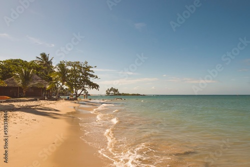 Morro de São Paulo, Bahia, Brazil. Natural landscape on the beach in the afternoon at high tide.