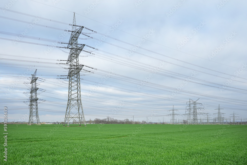 © Silhouette Boss - Electrical grid. A lot of high-voltage power line, transmission tower overhead line masts, high voltage pylons as power pylons on the fields © Silhouette Boss - Electrical grid. A lot of high-voltage power line, transmission tower overhead line masts, high voltage pylons as power pylons on the fields