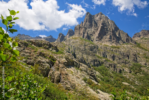 Hiking trail to Lake Lac du Melu in Restonica valley. Landscape view of the peaks of the Restonica mountains, Lac du Melu, Corsica island, France