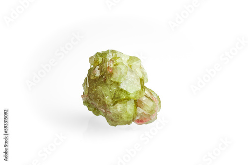 green vesuvianite (also known as idocrase) crystal isolated on white blackground. macro detail  background. close-up Rough raw unpolished semi-precious gemstone. photo