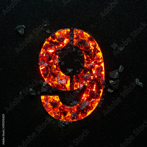 Photo of the burning number nine on a black background made of hot coals.