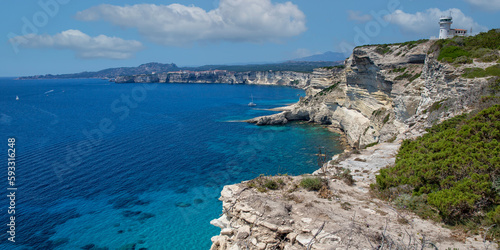 Landscape view of the famous chalk cliffs of Bonifacio. The famous rugged chalk cliffs and turquoise blue sea coast at Bonifacio, Capo Pertusato, Corsica island, France