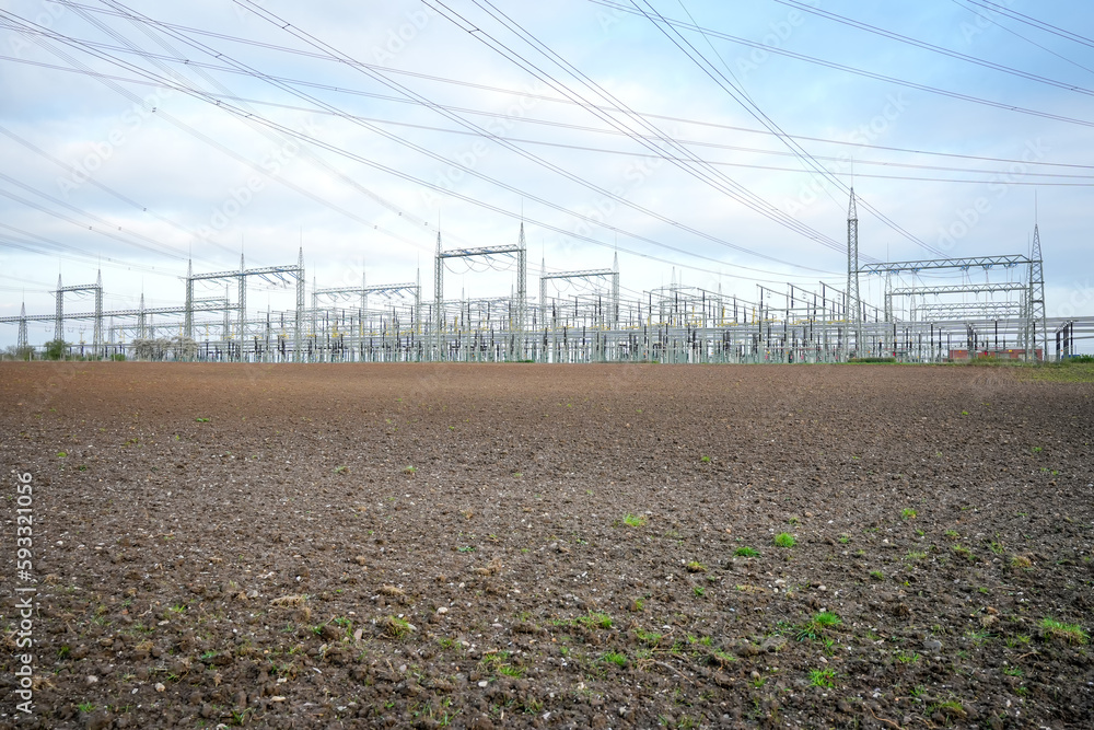 Power lines and substation, extra high voltage lines behind the