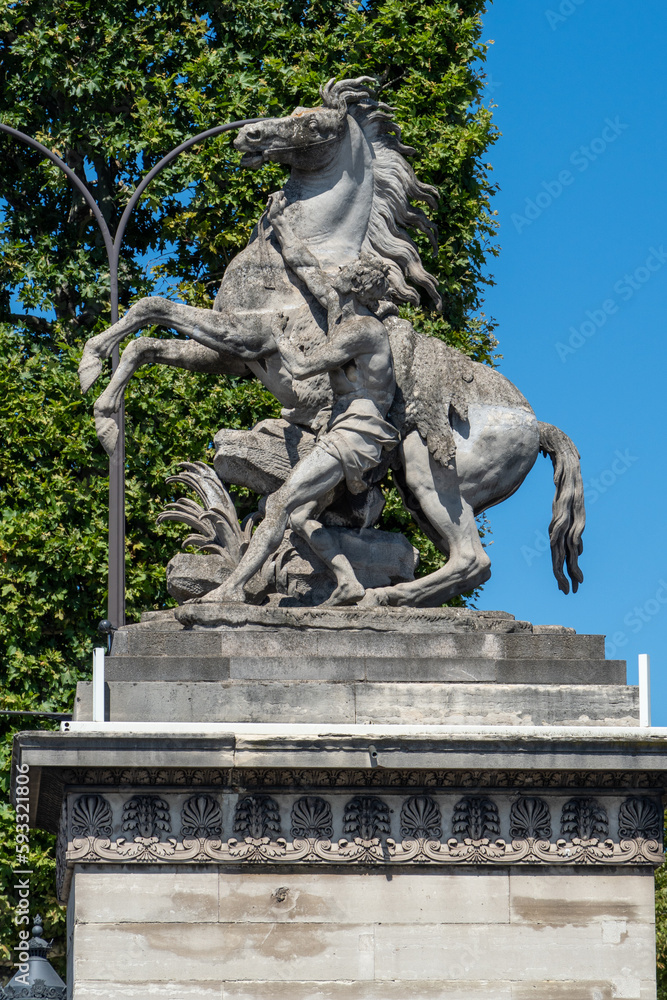 Statue of horse and man struggling in Paris, France. Statue of horse and man struggling in Paris, France.