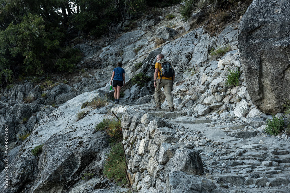 Two Hikers Climb up Four Mile Trail