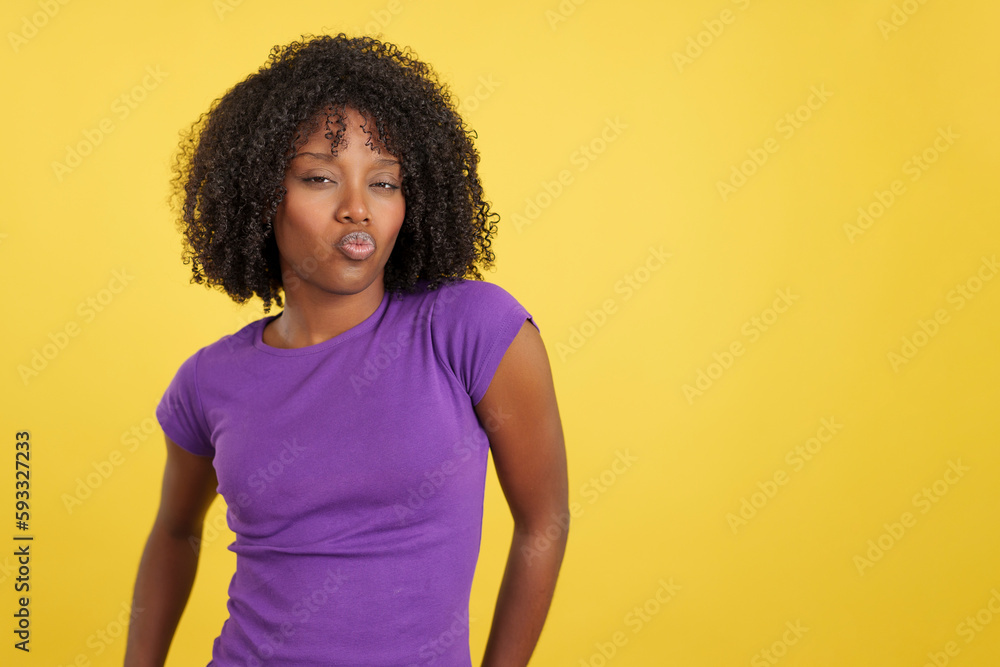 Provocative woman with afro hair kissing at camera Provocative woman with afro hair kissing at camera