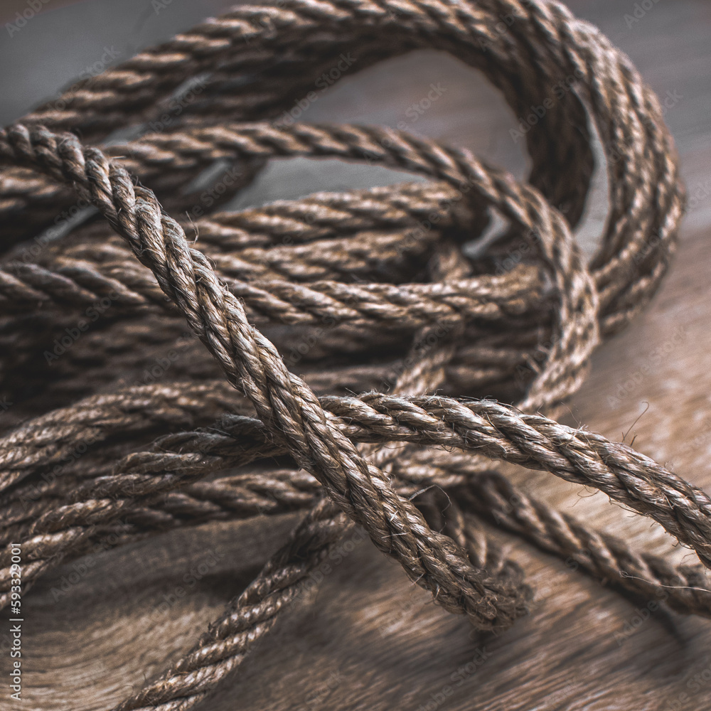 Texture of jute rope close-up. Twisted coarse rope. A skein of jute. Natural material for decoration. Textile cord. Small rope. Texture of jute rope close-up. Twisted coarse rope. A skein of jute. Natural material for decoration. Textile cord. Small rope.