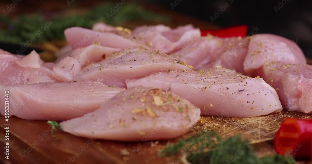 Freshly washed and skinned chicken meat, chicken fillets with salt and spices ready for cooking Freshly washed and skinned chicken meat, chicken fillets with salt and spices ready for cooking