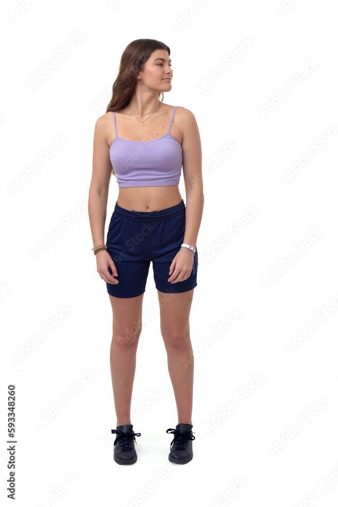 front view of a young girl standing looking away on white background front view of a young girl standing looking away on white background
