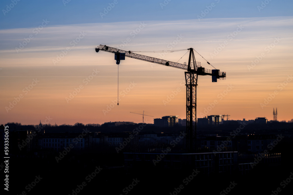 Construction crane at twilight, with cityscape background. High quality generative ai Construction crane at twilight, with cityscape background. High quality generative ai