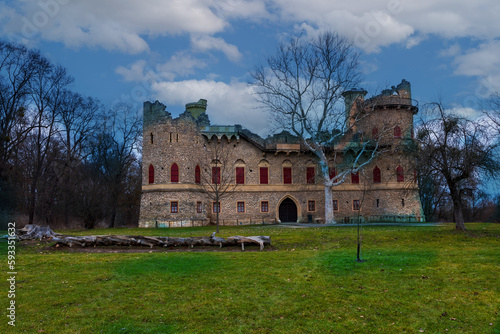 The ruins of the ancient castle Januv castle. Valtice area by the river Stara Dyje in the Czech Republic. There are dramatic clouds in the sky. photo