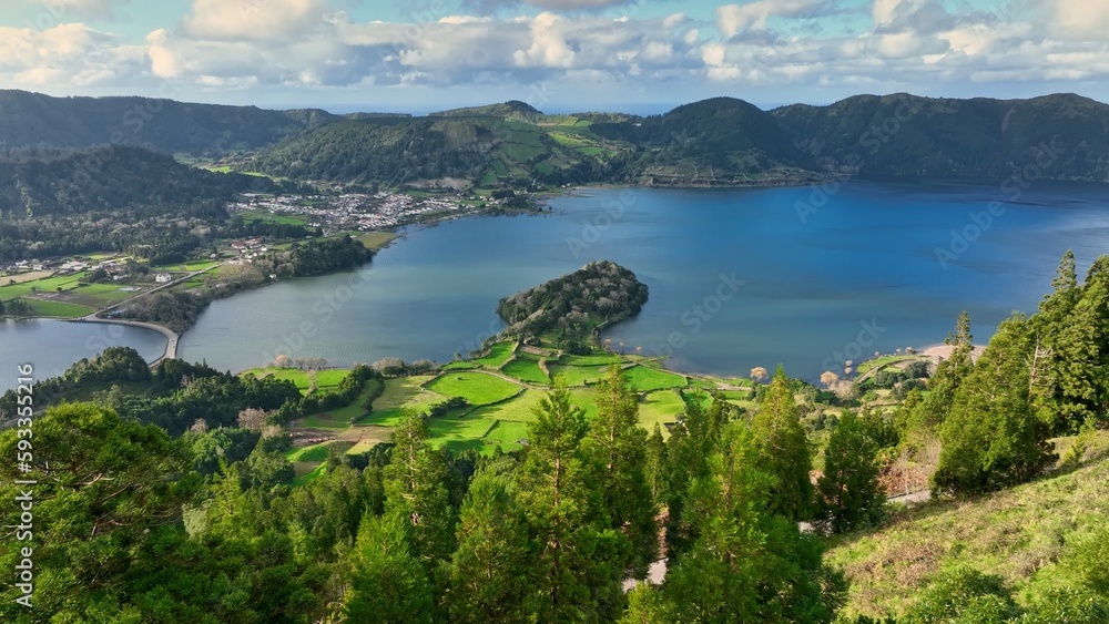 Aerial view of famous Lagoa das Sete Cidades lake. Lakes in the craters of extinct volcanoes surrounded by green vegetation. Sao Miguel Island, Azores, Portugal