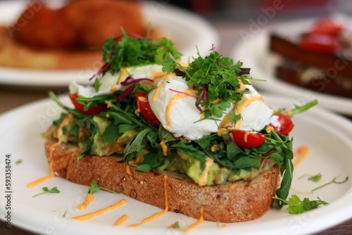 Avocado toast and other breakfast in backgroundt
