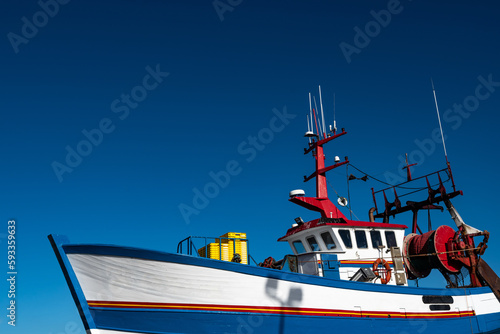 фотографія Fishing Boat In The Harbor Docks Of Finistere City Guilvinec At The Coast Of Atl