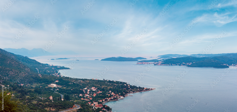 Sea twilight panorama, Croatian islands and Viganj village on seashore (Peljesac peninsula, Croatia).