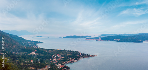 Sea twilight panorama  Croatian islands and Viganj village on seashore  Peljesac peninsula  Croatia .