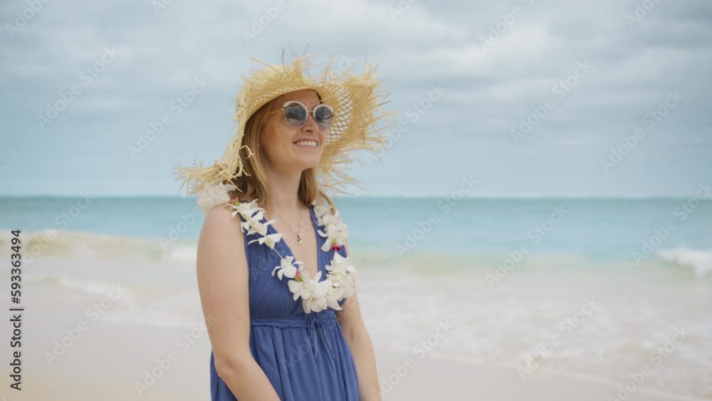 Outdoor portrait of happy romantic lady standing on tropical beach at beautiful ocean bokeh background. Smiling girl in trendy boho fashion style and straw hat. Travel vacation, Hawaii summer pleasure Outdoor portrait of happy romantic lady standing on tropical beach at beautiful ocean bokeh background. Smiling girl in trendy boho fashion style and straw hat. Travel vacation, Hawaii summer pleasure