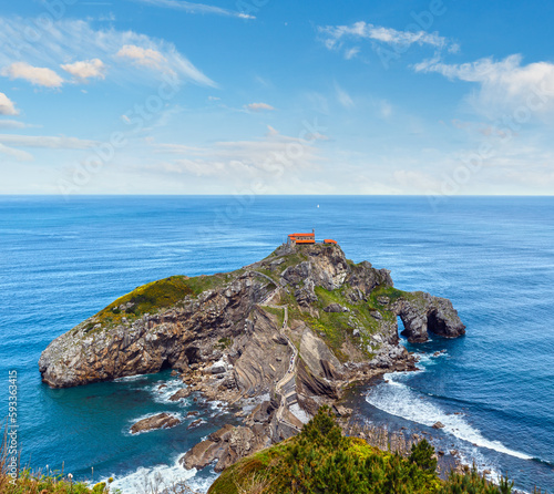 Doniene Gaztelugatxeko hermitage on top of Gaztelugatxe island. Biscay, Basque Country (Spain). Dates from the 10th century. All people are unrecognizable. photo