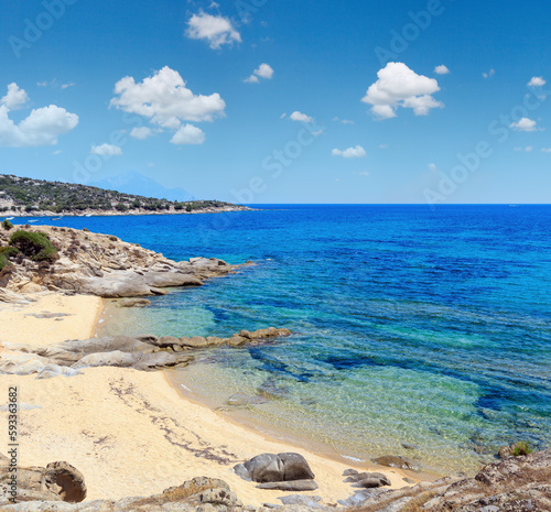 Fototapeta Naklejka Na Ścianę i Meble -  Summer sea scenery with aquamarine transparent water and sandy beach. View from shore (Sithonia, Halkidiki, Greece).