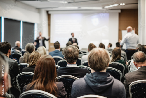 Wallpaper Mural I have a question. Group of business people sitting at the chairs in conference hall. Businessman standing up asking a question. Conference and Presentation. Business and Entrepreneurship. Torontodigital.ca
