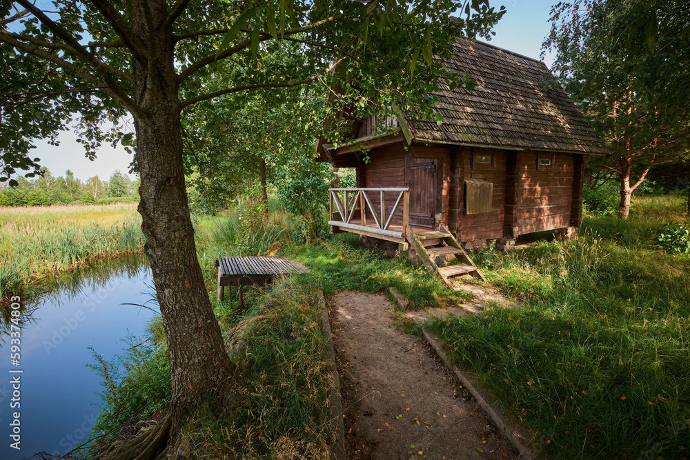 Bath house on the shore of the pond in summer. Bath house on the shore of the pond in summer.