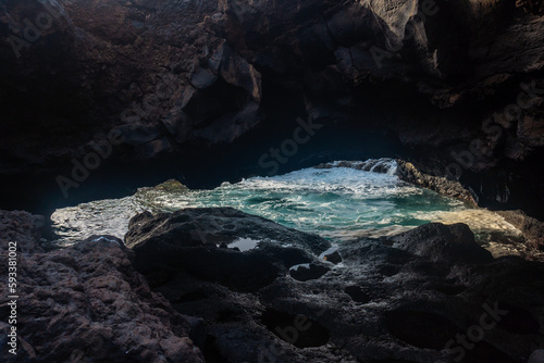 Sunset on El Hierro Island. Canary Islands, arch of volcanic rocks in the natural pool of Charco Azul