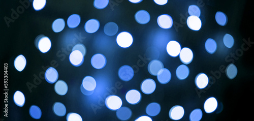 Abstract festive elegant blue background of blurred with bokeh lights and stars texture, banner