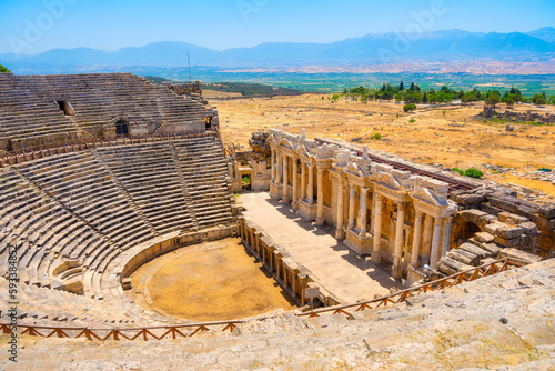 Hierapolis, Pammukale, Turkey. Ancient amphitheater. Panoramic landscape in the daytime. UNESCO Heritage Site. Historic Site. A vacation and tourism destination. photo