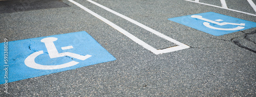 Tela The blue handicap sign on the street is a universal symbol for accessibility and