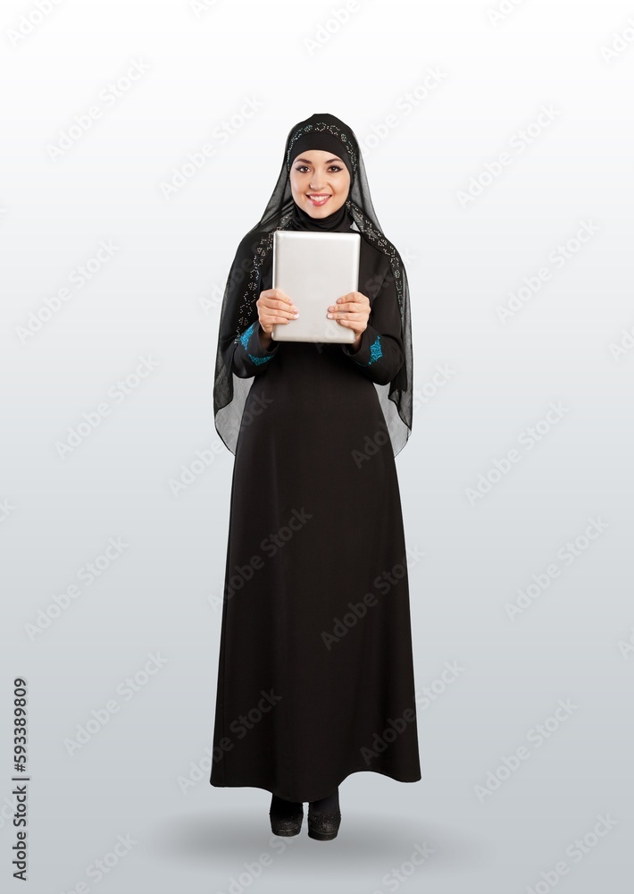 a young woman in traditional hijab posing