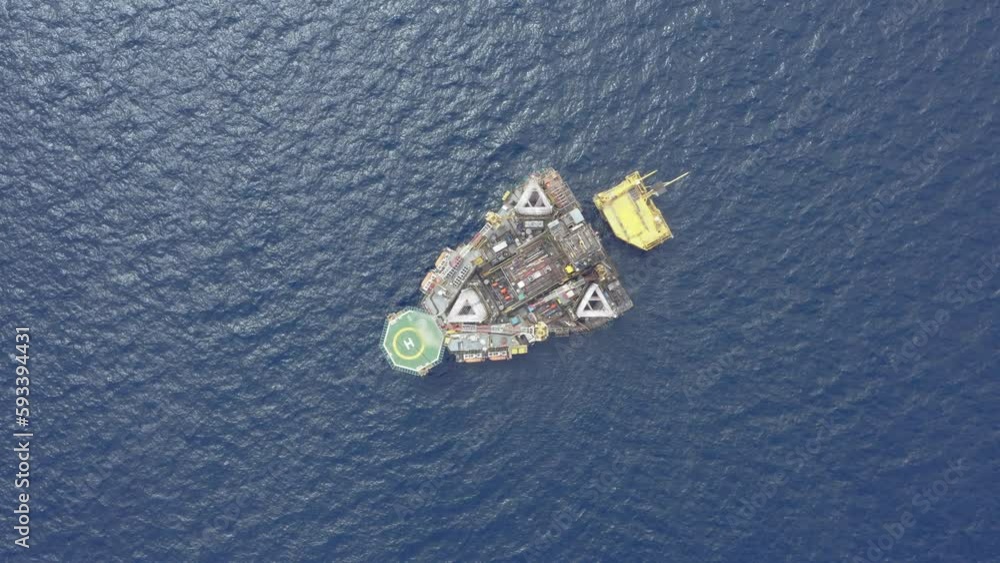 Aerial top view from a drone of an offshore jack up rig at the offshore location during day time
Aerial top view from a drone of an offshore jack up rig at the offshore location during day time