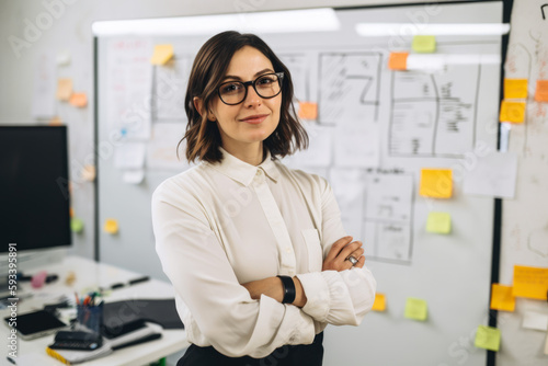 Confident and stylish female copywriter in a modern office space surrounded by whiteboards, brainstorming sessions and creative ideas, generative ai