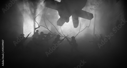 Wallpaper Mural Concept of war or manipulation with global politics. The puppeteer controls soldiers. Night battle scene. Military fighting silhouettes in destroyed city. Torontodigital.ca