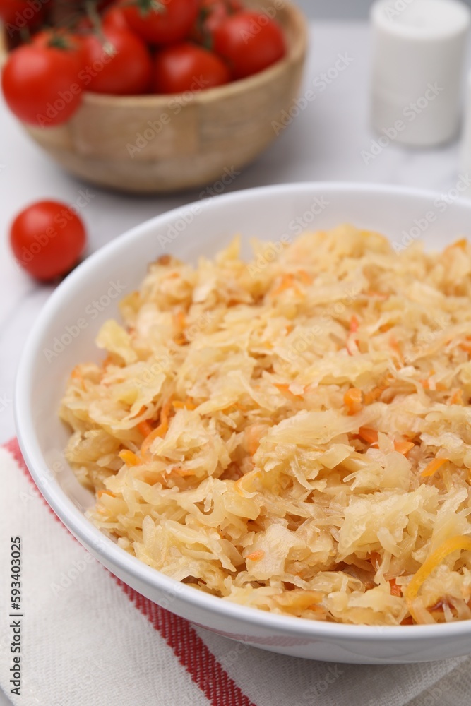 Bowl with tasty sauerkraut on table, closeup Bowl with tasty sauerkraut on table, closeup