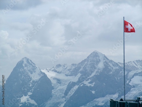 swiss flag in the mountains