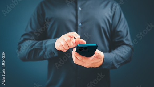 Man viewing website social network connecting with wifi in home by mobile phone. Male hands holding a smartphone model touching sensor screen to browse internet. Concept of Virtual communication.