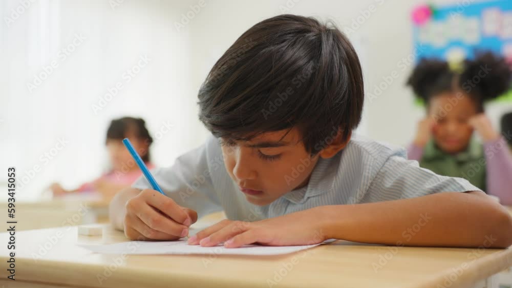 Adorable student learn with teacher in classroom at elementary school. Adorable student learn with teacher in classroom at elementary school.