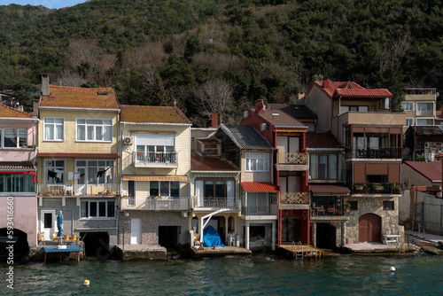 View of residential buildings in the fishing village of Kanadolu Kavagi on the shore of the Bosphorus Strait on a sunny day, Istanbul, Turkey